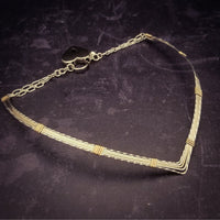 A beautiful symbol of your D/s dynamic, this contemporary V Style Locking BDSM submissive collar is hand crafted in mixed precious metals of sterling silver and gold. As strong and beautiful as the submissive’s heart, this high-quality artisan collar is made to last and will be the foundation of your private collection