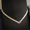A beautiful symbol of your D/s dynamic, this contemporary V Style Locking BDSM submissive collar is hand crafted in mixed precious metals of sterling silver and gold. As strong and beautiful as the submissive’s heart, this high-quality artisan collar is made to last and will be the foundation of your private collection