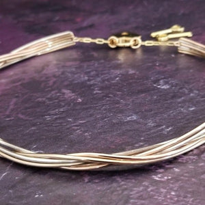 Precious metals are gently woven together into a locking submissive collar that is pure luxury. Beautifully discreet for day wear, it certainly looks like a traditional collar, but ... a lock in the back reminds the submissive of their trust and devotion to their Dominant.