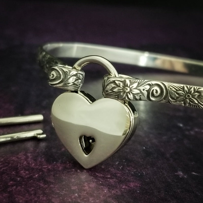 Our ‘WILD FLOWER’ collection speaks of rambling cottage gardens. Sensual and romantic. This artisan BDSM submissive jewelry is handcrafted in a floral pattern of sterling silver. Truly a high-quality artisan collar made to last; it will be a cherished addition to any collection. A beautiful symbol of commitment/ wedding gift for those in a D/s relationship. My Secret Heart Studios
