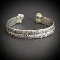 Our ‘WILD FLOWER’ collection speaks of rambling cottage gardens. Sensual and romantic. This artisan BDSM submissive jewelry is handcrafted in a floral pattern of sterling silver. Truly a high-quality artisan collar made to last; it will be a cherished addition to any collection. A beautiful symbol of commitment/ wedding gift for those in a D/s relationship. My Secret Heart Studios