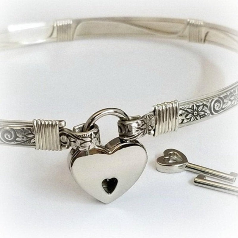 The ‘WILD FLOWER’ BDSM Submissive Collar is hand crafted in Sterling Silver filled floral pattern and wrapped with sterling silver accents. Truly a high-quality artisan collar made to last; it will be a cherished addition to any collection. A beautiful symbol of a D/s relationship.