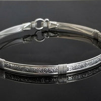 The ‘WILD FLOWER’ BDSM Submissive Collar is hand crafted in Sterling Silver filled floral pattern and wrapped with sterling silver accents. Truly a high-quality artisan collar made to last; it will be a cherished addition to any collection. A beautiful symbol of a D/s relationship.