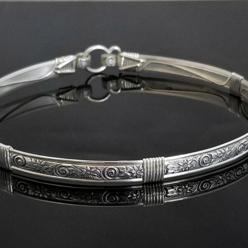 The ‘WILD FLOWER’ BDSM Submissive Collar is hand crafted in Sterling Silver filled floral pattern and wrapped with sterling silver accents. Truly a high-quality artisan collar made to last; it will be a cherished addition to any collection. A beautiful symbol of a D/s relationship.