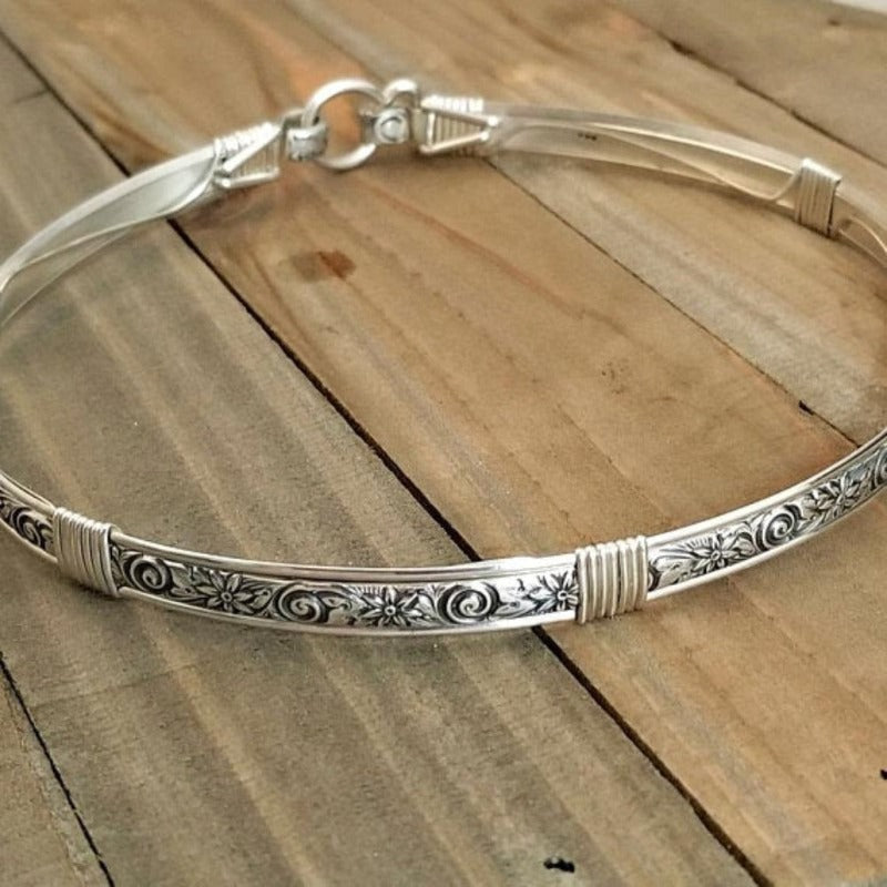The ‘WILD FLOWER’ BDSM Submissive Collar is hand crafted in Sterling Silver filled floral pattern and wrapped with sterling silver accents. Truly a high-quality artisan collar made to last; it will be a cherished addition to any collection. A beautiful symbol of a D/s relationship.