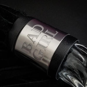 Get your kink on with this BDSM Flogger in Purple Leather and Glass. With a whip on one end and a glass dildo on the other, you’ll have the perfect balance between pleasure and pain! Can be Monogrammed / Engraved. By My Secret Heart Studios