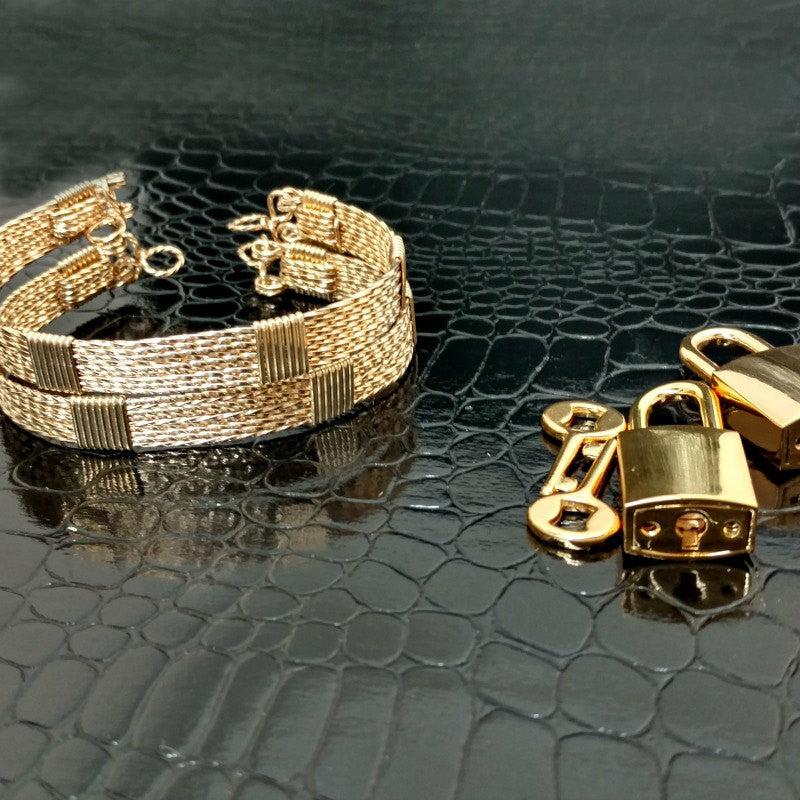 Wire wrapped submissive bracelets that are hand crafted in strands of twisted 14k gold filled and accented with 14k gold filled wraps. 