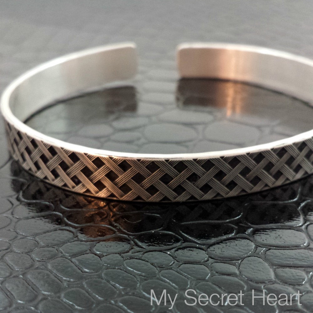Our Darkenwald design is reminiscent of old castle walls, knights on galloping horses and laughter and ale in the great hall by firelight.  Substantial sterling silver. PERFECT COMPANION to our Darkenwald Collars & Submissive Cuffs
