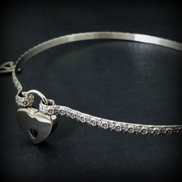 Flaunt your femininity with our sterling LOKELANI artisan submissive collar. Carefully crafted with an exquisite floral pattern and patina-finished for enhanced texture, this BDSM Locking Collar is a timeless piece of quality to be treasured and proudly displayed. Adopt this mythical rose and add to your private collection today!