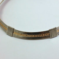Precious metals embrace to create a seductive collection of artisan wire wrapped jewelry. Big, bold and dramatic, this unisex artisan collar is created with centuries old wire wrapping techniques, using only a few hand tools.