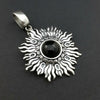 Dramatic Fire pendant with hand set with a  gemstone cabochon in your choice of black onyx, carnelian or moonstone. The pendant is sterling silver, the bail is silver plated. Can be worn as a pendant on a chain, or slide onto most all or our artisan collars.